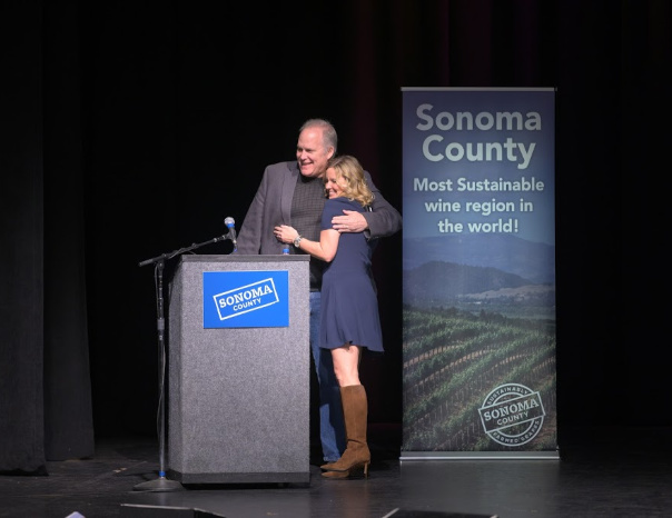 Man and woman speaking at a Sonoma County conference