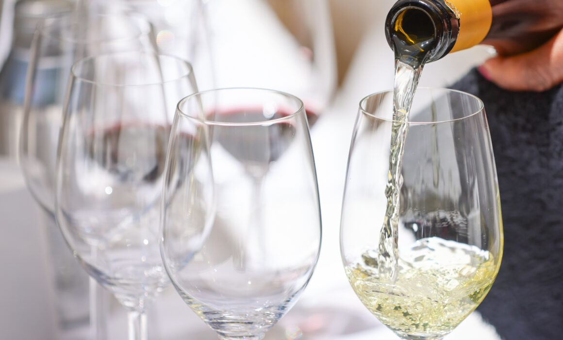 Bottle of wine being poured into a glass